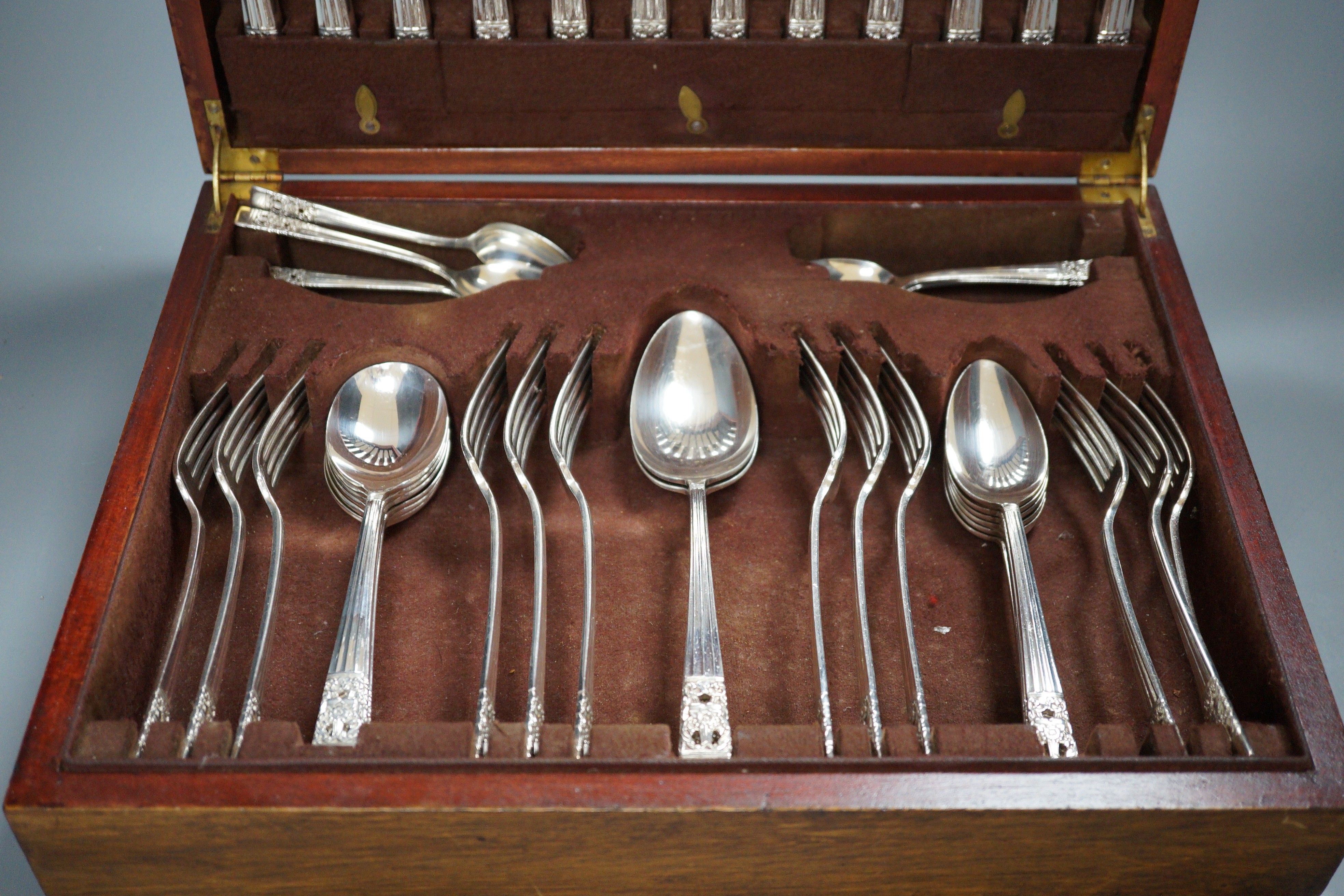 A canteen of silver plated cutlery, a four piece plated tea set and a plated egg coddler.